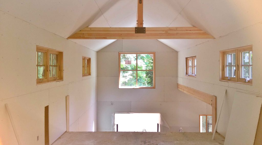 View from loft to double height dining room