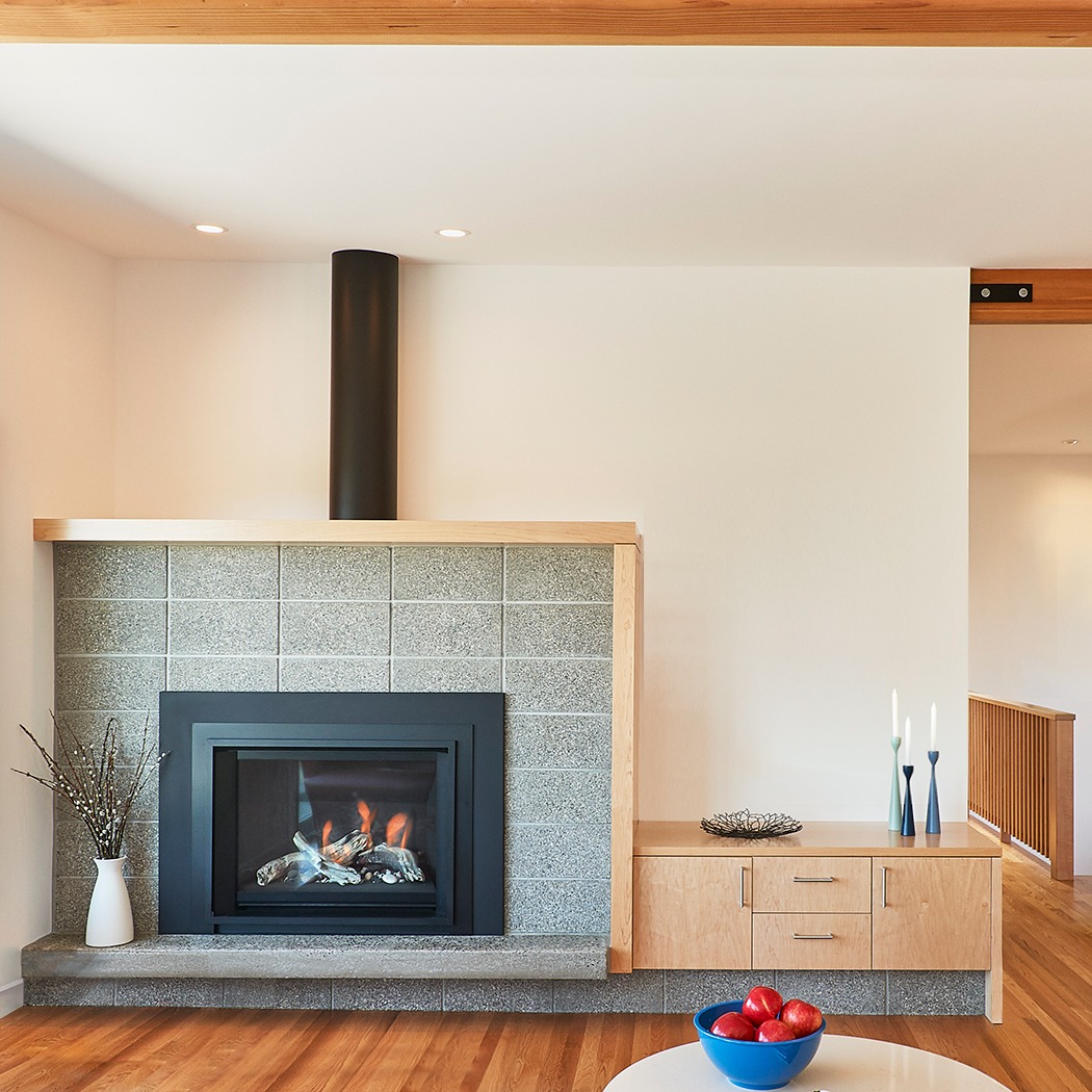 Scandinavian modern concrete block fireplace at the MidCentury-Move house remodel.