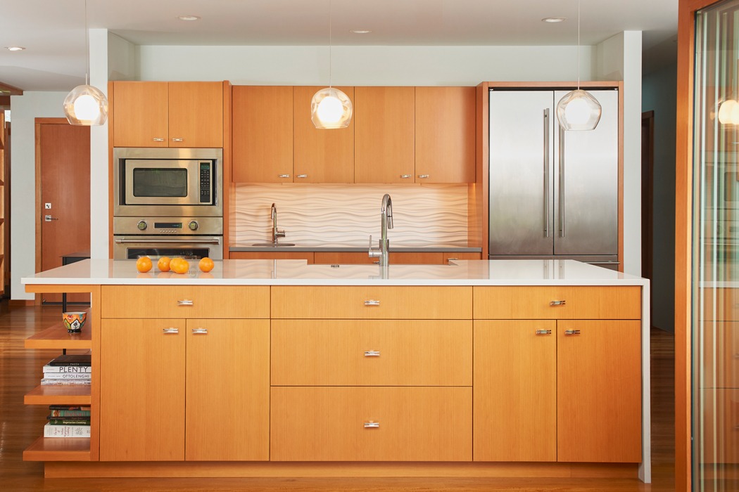 seattle neighbor kirkland mid century modern remodel custom kitchen island with floating shelves and waterfall edge, and textured tile backsplash.